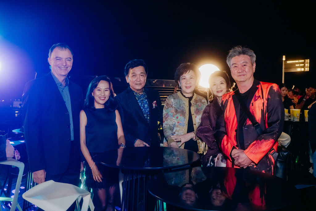 Corporate event attendees networking and smiling, illustrating what 'wow' means on a budget through engagement and lasting memories.