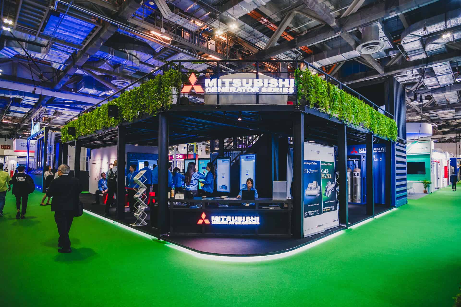 The Mitsubishi Heavy Industries two-storey innovation booth featuring the MGS2500R containerized generator at Data Centre World Asia.