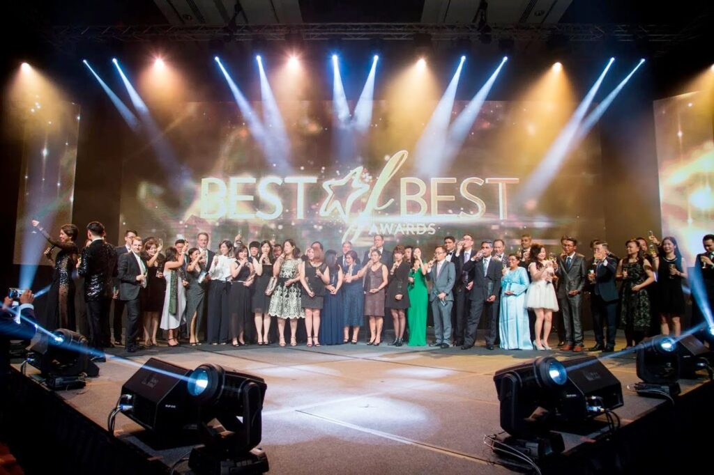 Award winners on stage at a Singapore gala event, highlighting the importance of choosing the right event planner.